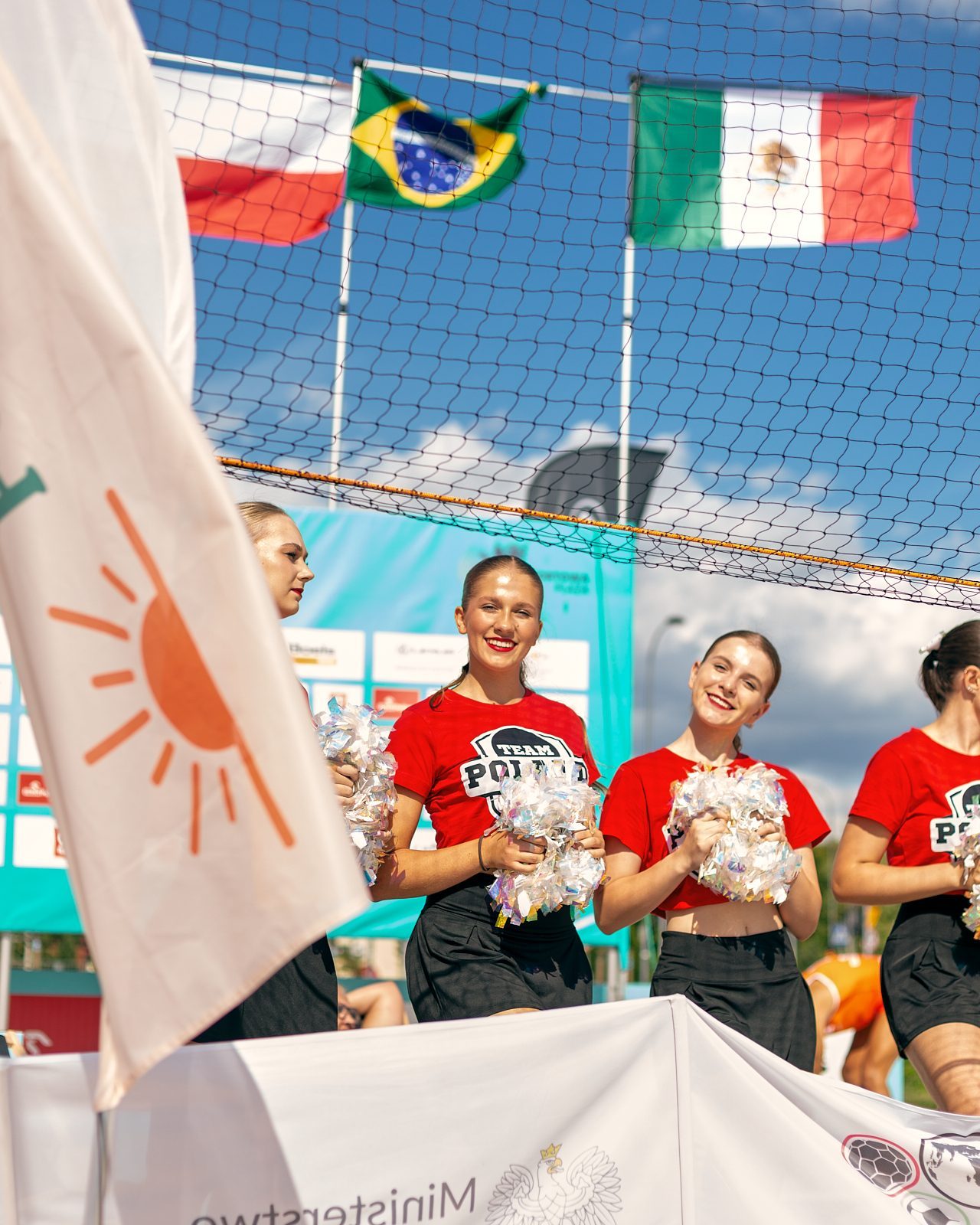 Crowd with flags watching a footvolley match